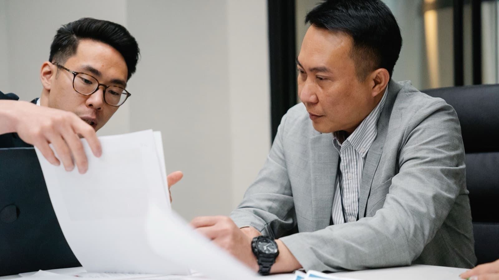 IES inspection engineers reviewing technical documentation in a modern engineering office